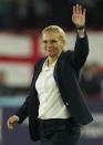 England's manager Sarina Wiegman waves at the end of the Women Euro 2022 semi final soccer match between England and Sweden at Bramall Lane Stadium in Sheffield, England, Tuesday, July 26, 2022. (AP Photo/Jon Super)