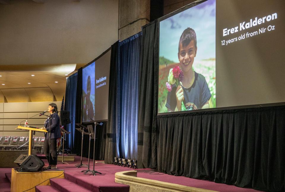 Aya Margalit, of Dallas, remembers the 23 members of her community is Israel that have been taken by Hamas during a Jewish community gathering at Adat Shalom Synagogue in Farmington Hills on Tuesday, Nov. 7, 2023.