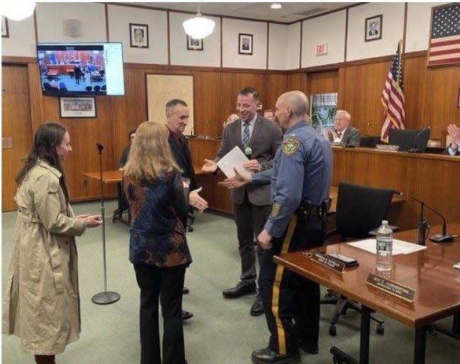 Upper Saddle River Police Officer Philip Tangel is sworn in as a Class III special law enforcement officer for the grade school district by Mayor Arman Fardanesh.