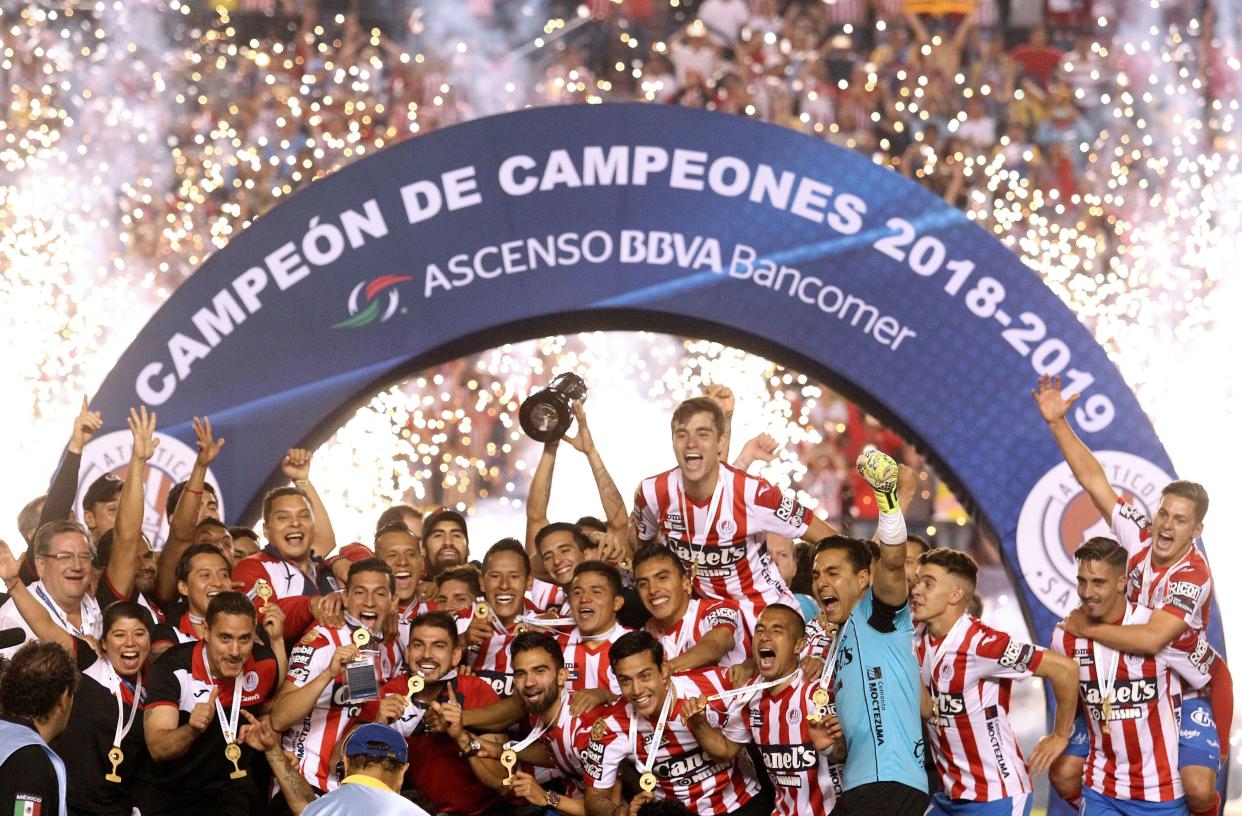 Players of Mexican football team Atletico San Luis of second division celebrate after winning the championship, after defeating Dorados of Argentine head coach Diego Armando Maradona in the second leg match of the Mexican second-division finals, at the Alfonso Lastras Ramirez stadium in San Luis Potosi, Mexico, on May 5, 2019. (Photo by Ulises Ruiz / AFP)        (Photo credit should read ULISES RUIZ/AFP/Getty Images)