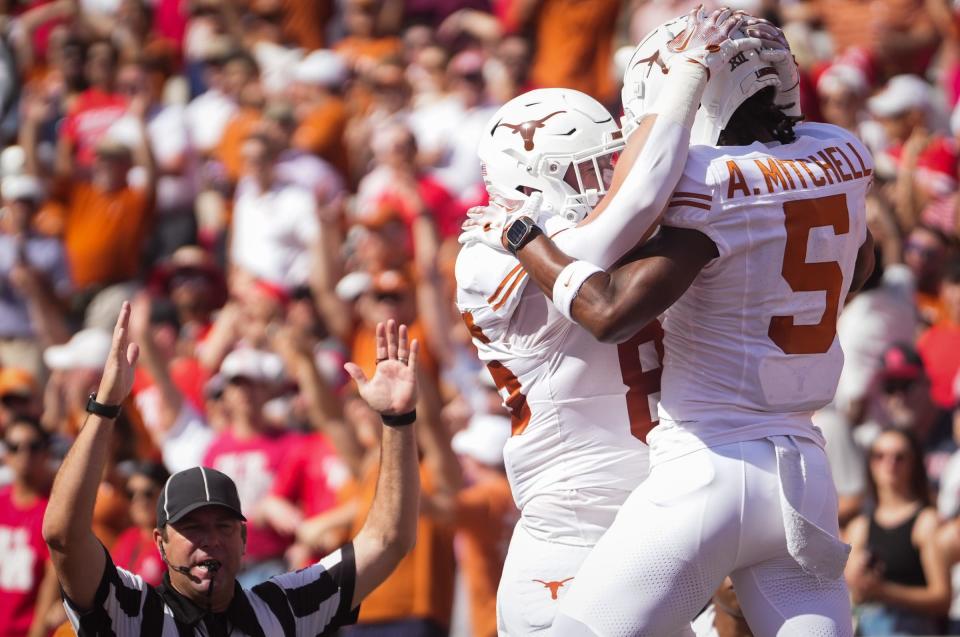 Texas wide receiver Adonai Mitchell celebrates his first-quarter touchdown that gave the Longhorns an early 7-0 lead over Houston on Saturday.