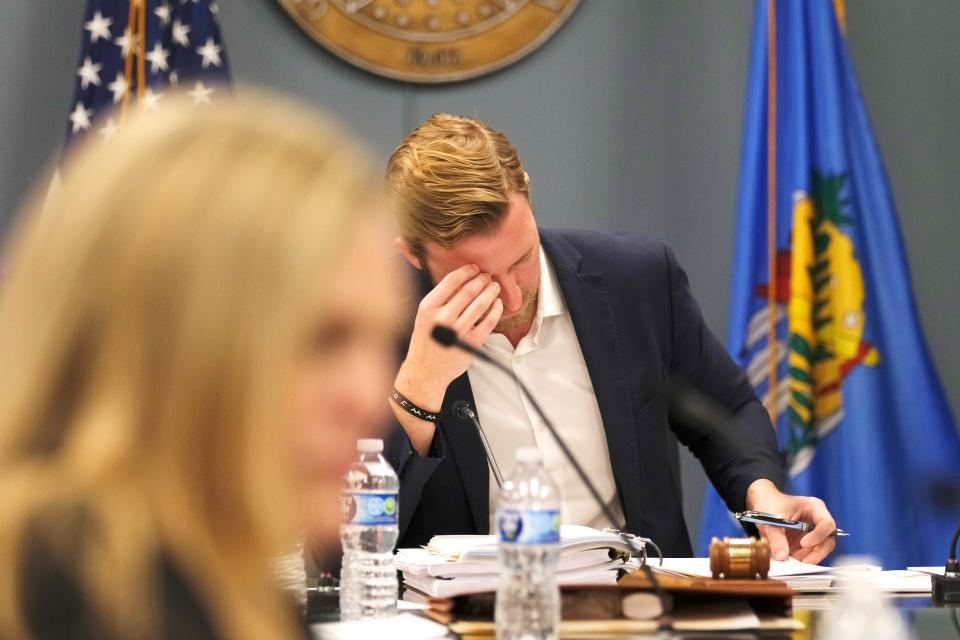 State schools Superintendent Ryan Walters looks over material at the February meeting of the Oklahoma State Board of Education.