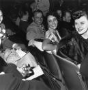 <p>Elizabeth and her boyfriend, American football player and Heisman Trophy winner Glenn Davis, attend a movie premiere together in 1945. The pair began dating while Glenn was on leave from the Army. </p>