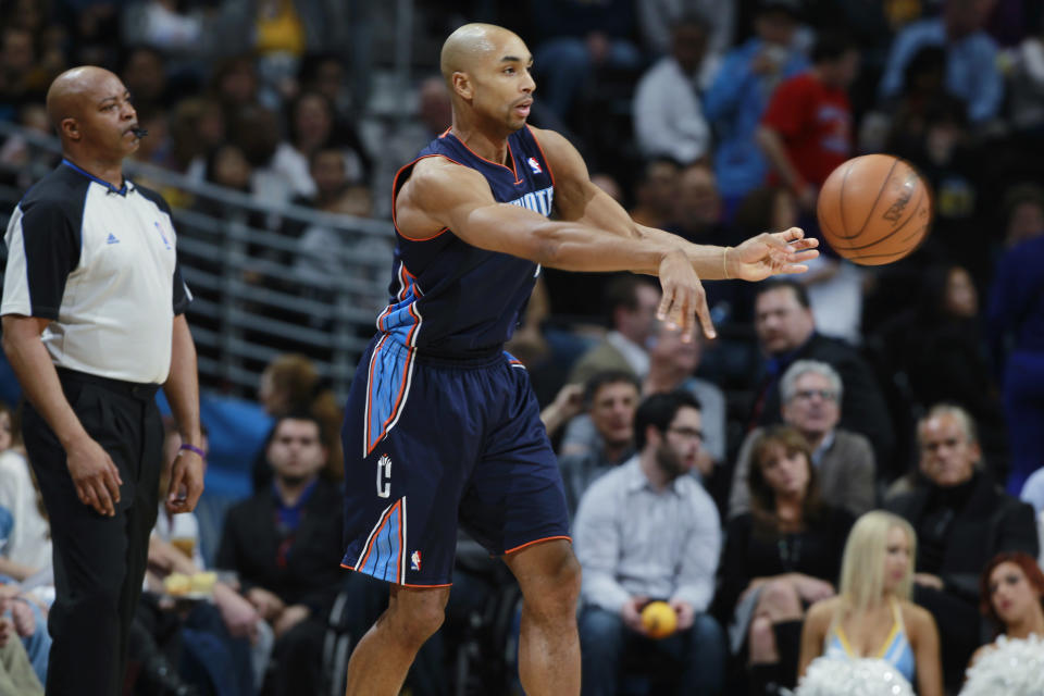 Charlotte Bobcats guard Gerald Henderson passes ball against the Denver Nuggets in the third quarter of the Bobcats' 101-98 victory in an NBA basketball game in Denver on Wednesday, Jan. 29, 2014. (AP Photo/David Zalubowski)
