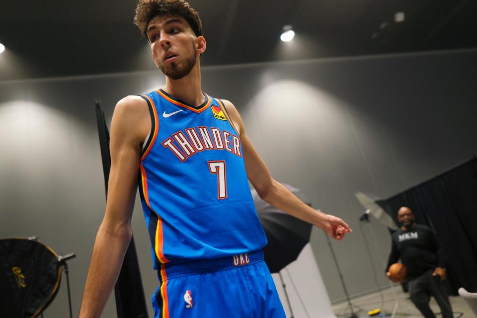 Chet Holmgren (7) moves between photo stations at Thunder Media Day, held in the Oklahoma City Convention Center on Monday, Oct. 2, 2023.