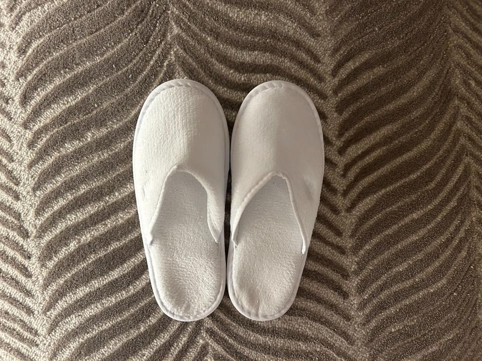 White slippers in hotel room