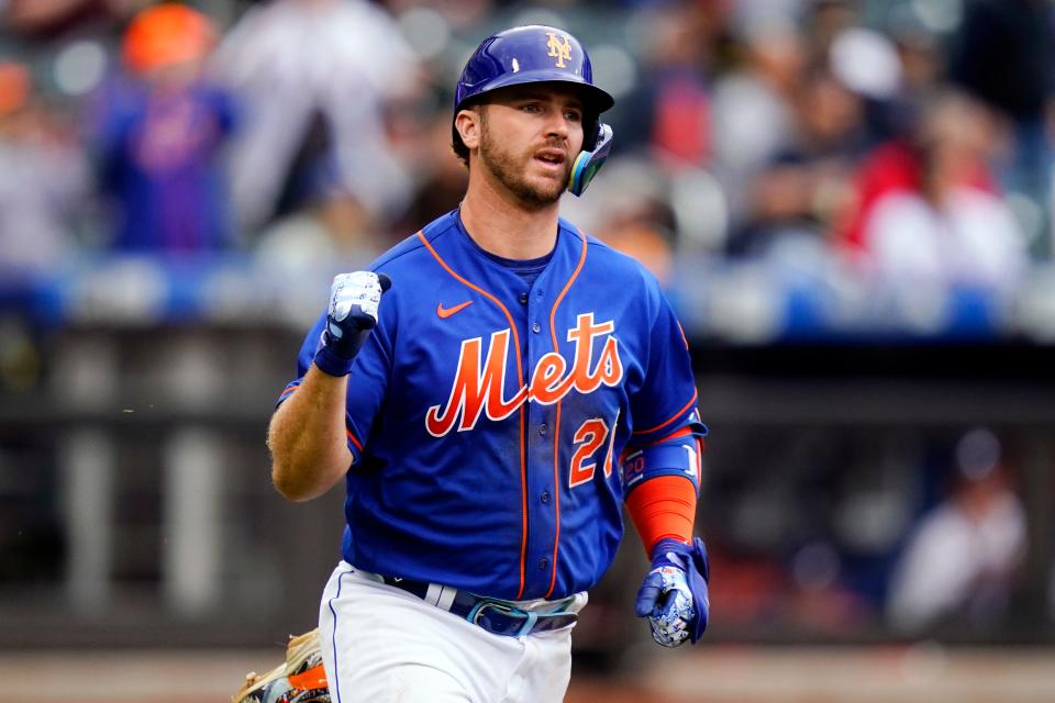 New York Mets' Pete Alonso gestures as he runs to first base for an RBI single during the second inning in the first baseball game of a doubleheader against the Atlanta Braves, Tuesday, May 3, 2022, in New York.