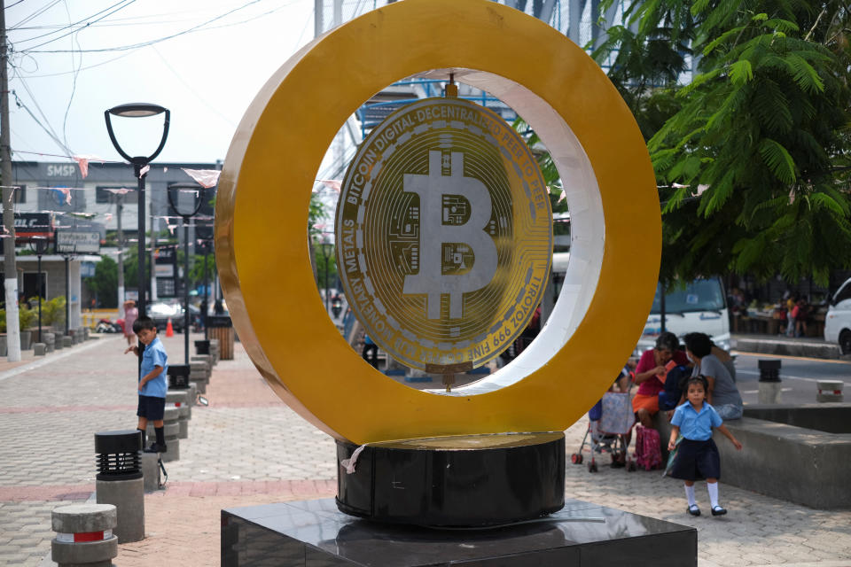 Children play by a Bitcoin sign at the Bitcoin Plaza, in Ilopango, El Salvador, May 21, 2024. REUTERS/Jose Cabezas