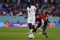 Ghana's Mohammed Salisu fouls in the penalty box Portugal's Cristiano Ronaldo during a World Cup group H soccer match at the Stadium 974 in Doha, Qatar, Thursday, Nov. 24, 2022. (AP Photo/Manu Fernandez)