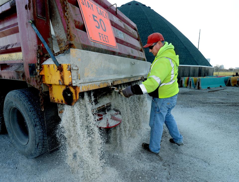 Tom James, a truck driver for the city of Springfield, gets a dump truck ready to be filled with salt at the salt dome at the Public Works Street Dept. Tuesday Dec. 20, 2022.