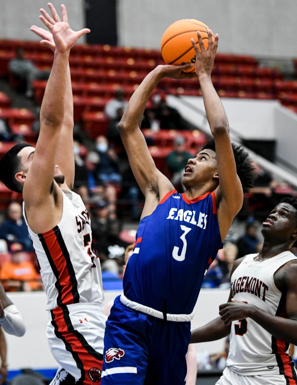 Issac Tevarus (right) of North Florida Educational Institute takes a shot against Sagemont in the Class 2A boys basketball semifinals.