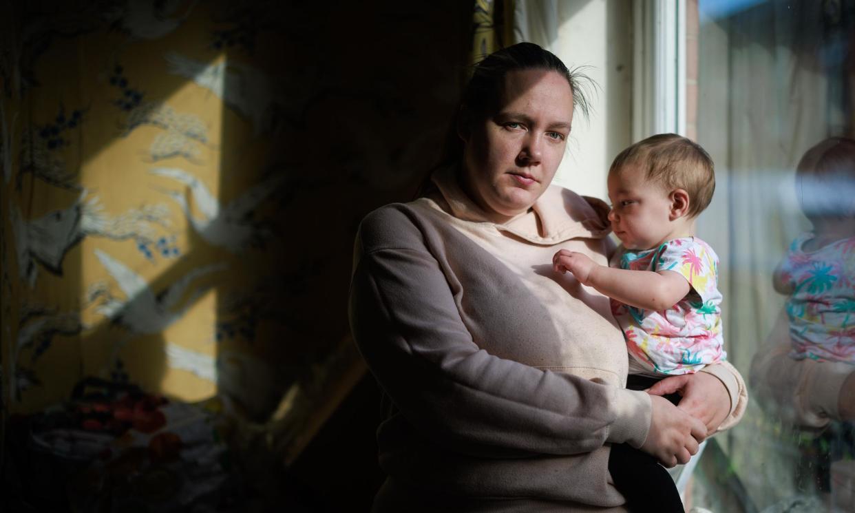 <span>Jessica Burns with her youngest child, for whom childcare can be hard to arrange when her hours change at short notice.</span><span>Photograph: Joel Goodman/The Guardian</span>