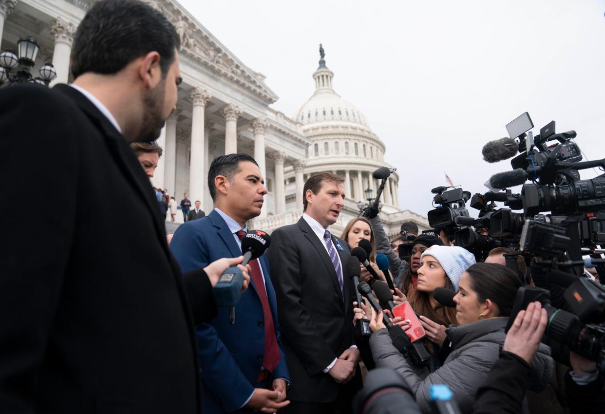 Rep. Robert Garcia (D-California), left, speaks to the news media in December. Garcia is teaming up with Rep. Glenn Grothman (R-Wisconsin) to introduce a bill that would create a mechanism allowing commercial airline pilots to report sightings of UFOs.