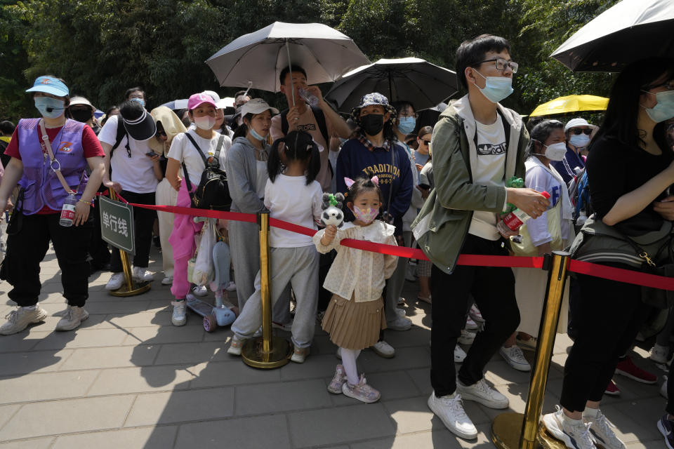 Visitors line up to visit the Panda enclosure in the zoo on the last day of the May Day holidays in Beijing, Wednesday, May 3, 2023. (AP Photo/Ng Han Guan)