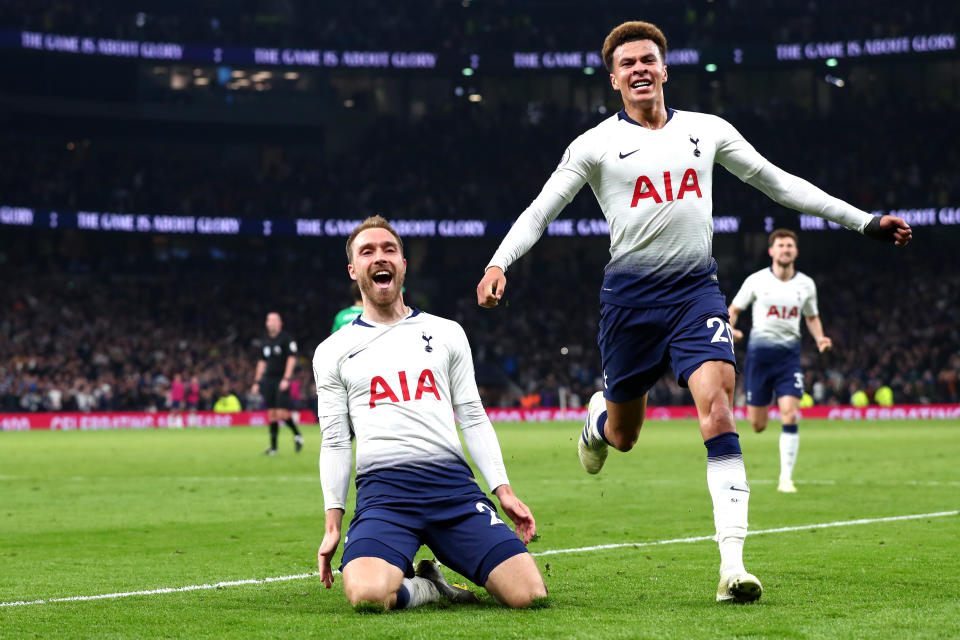 Christian Eriksen of Tottenham Hotspur celebrates with teammate Dele Alli after scoring his team's first goal during the Premier League match between Tottenham Hotspur and Brighton & Hove Albion