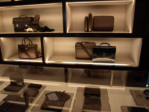 Men’s wallets, bags and shoes, at the Louis Vuitton Island Maison. (Yahoo! photo)