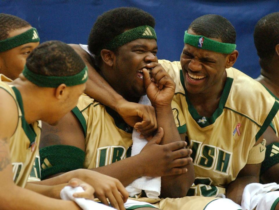 Sian Cotton, LeBron James and other St. Vincent-St. Mary players share a laugh during the final minutes of a game against Willard in December 2002.