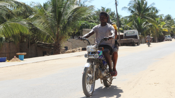Pelé Bambina on a mota taxi in Pemba, Mozambique