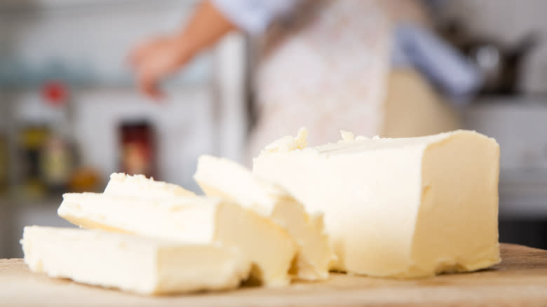 Close-up of white butter slices in kitchen