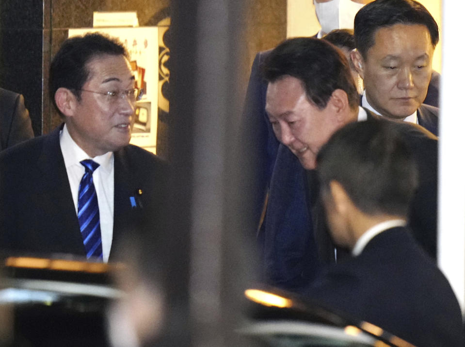 South Korean President Yoon Suk Yeol, center right, and Japanese Prime Minister Fumio Kishida, left, leave a Japanese food restaurant after dinner in Tokyo, Japan, Thursday, March 16, 2023. (Yohei Fukai/Kyodo News via AP)