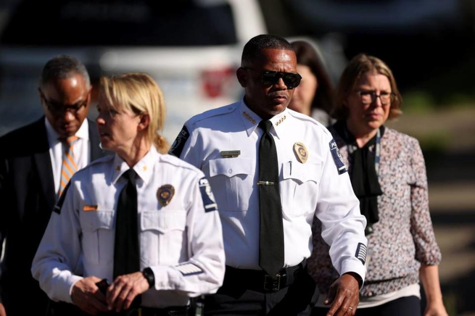 Charlotte Mecklenburg Police Chief Johnny Jennings, center, leaves the scene where multiple law enforcement officers were shot in the 5000 block of Galway Drive in Charlotte, NC on Monday, April 29, 2024.