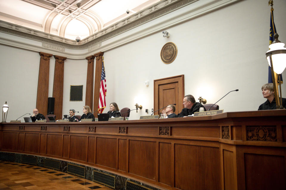 Oregon Supreme Court justices listen to the oral arguments made by attorneys representing Republican Oregon senators and the Department of Justice on Thursday, Dec. 14, 2023 in Salem, Ore. Republicans are challenging the implementation of Measure 113, an effort to put a stop to legislative walkouts. (Abigail Dollins/Statesman-Journal via AP, Pool)