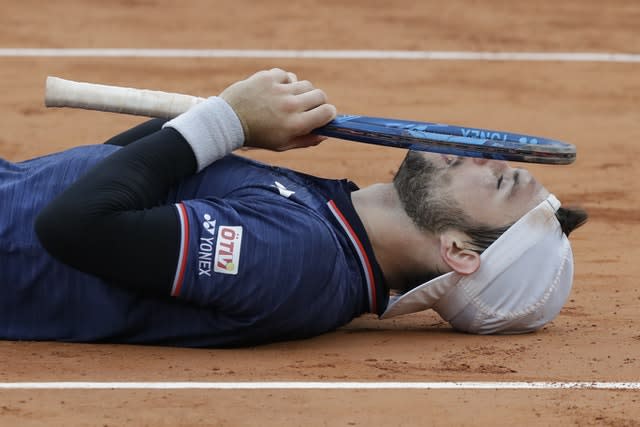 Austria’s Jurij Rodionov celebrates his five-set win over France’s Jeremy Chardy