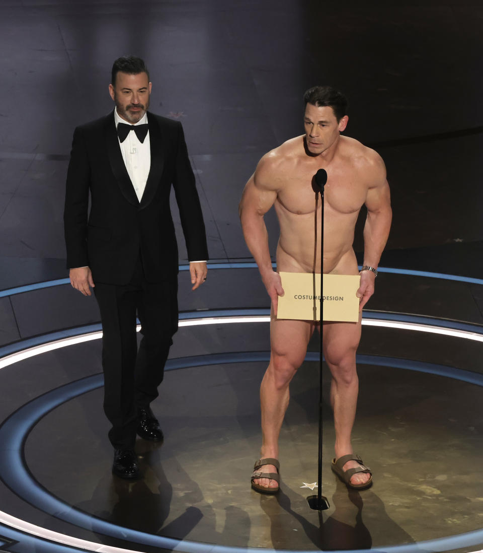 HOLLYWOOD, CALIFORNIA - MARCH 10: (L-R) Jimmy Kimmel and John Cena speak onstage during the 96th Annual Academy Awards at Dolby Theatre on March 10, 2024 in Hollywood, California. (Photo by Kevin Winter/Getty Images)