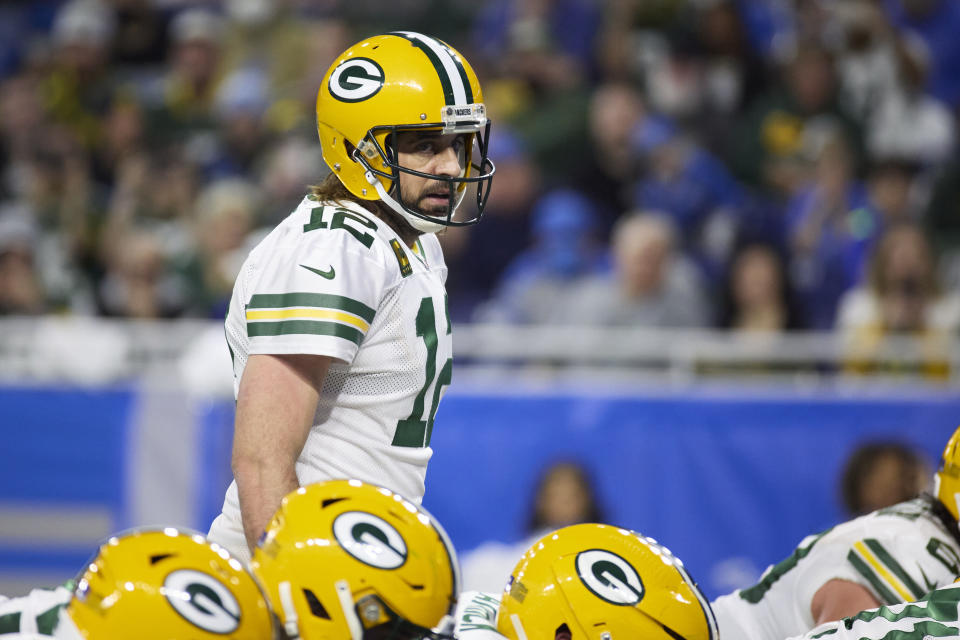 Green Bay Packers quarterback Aaron Rodgers (12) gets set to run a play against the Detroit Lions during an NFL football game, Sunday, Jan. 9, 2022, in Detroit. (AP Photo/Rick Osentoski)