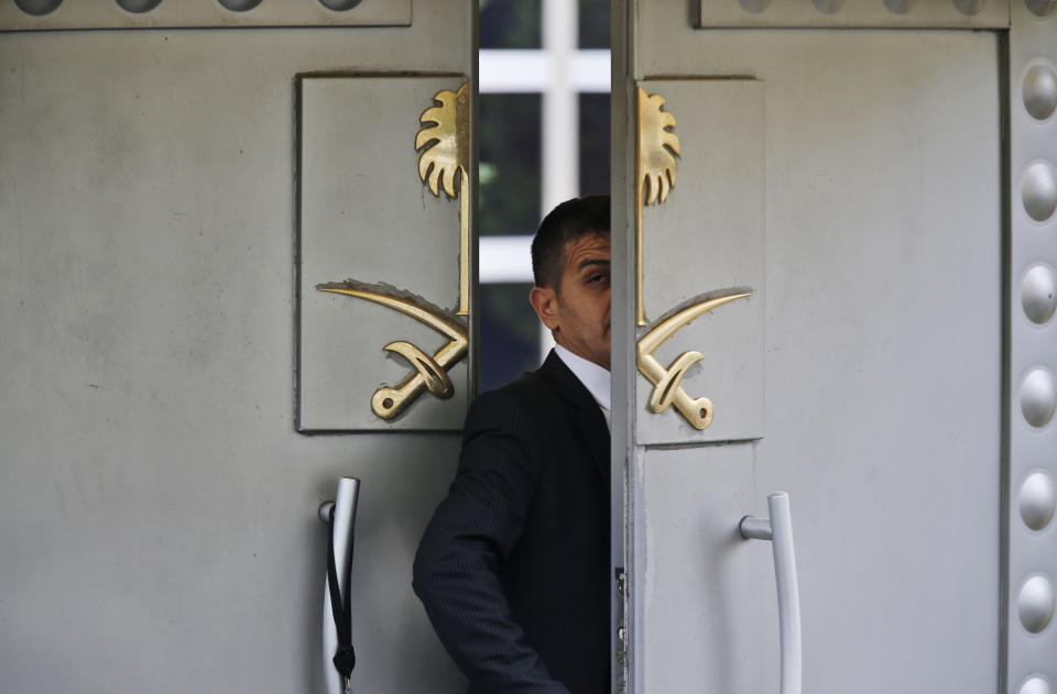 FILE - In this Tuesday, Oct. 9, 2018 file photo, a security guard walks in the Saudi Arabia consulate in Istanbul, Turkey. The disappearance of Khashoggi, during a visit to his country’s consulate in Istanbul last week, raises a dark question for anyone who dares criticize governments or speak out against those in power: Will the world have their back? (AP Photo/Lefteris Pitarakis, File)