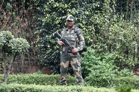 Security personnel stand guard outside Indian Prime Minister Narendra Modi's house in New Delhi