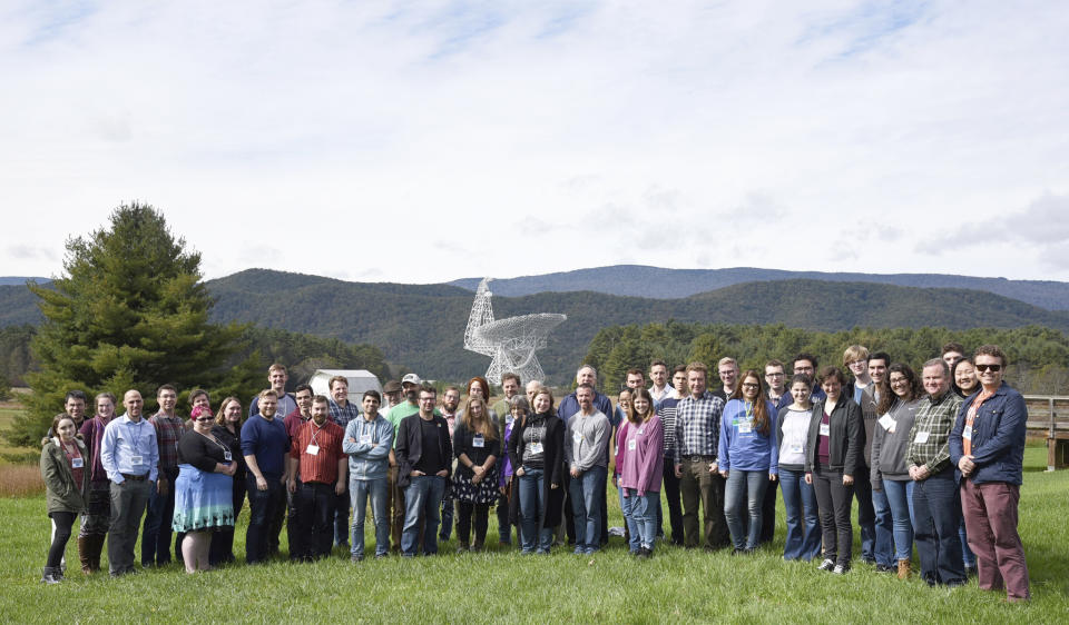 This photo provided by researchers shows NANOGrav team members meeting at Green Bank Observatory in Green Bank, W. Va., in 2018. On Wednesday, June 28, 2023, researchers reported signals from what they call low-frequency gravitational waves — changes in the fabric of the universe that are created by huge objects moving around and colliding in space. It took decades of work by scientists across the globe to track down the evidence for these super-slow wobbles. (NANOGrav via AP)