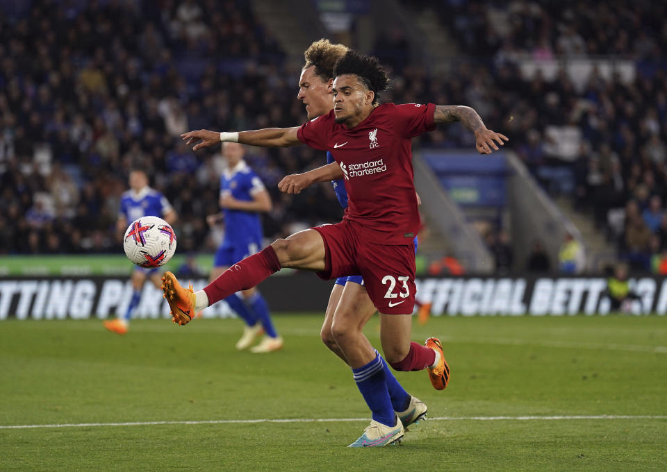 Liverpool's Luis Diaz, right, and Leicester City's Wout Faes battle for the ball during the English Premier League soccer match between Leicester City and Liverpool at the King Power Stadium, Leicester, England, Monday May 15, 2023. (Tim Goode/PA via AP)