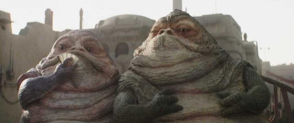 Two Hutt Slugs, one with a fan, another with a chin tattoo