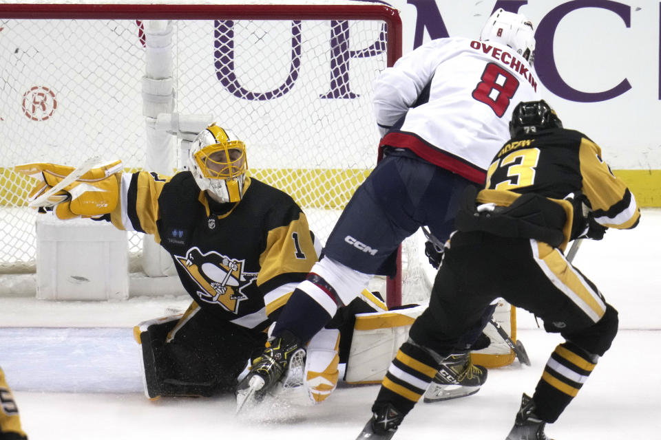 Pittsburgh Penguins goaltender Casey DeSmith (1) stops a breakaway shot by Washington Capitals' Alex Ovechkin (8) during the second period of an NHL hockey game in Pittsburgh, Saturday, March 25, 2023. (AP Photo/Gene J. Puskar)