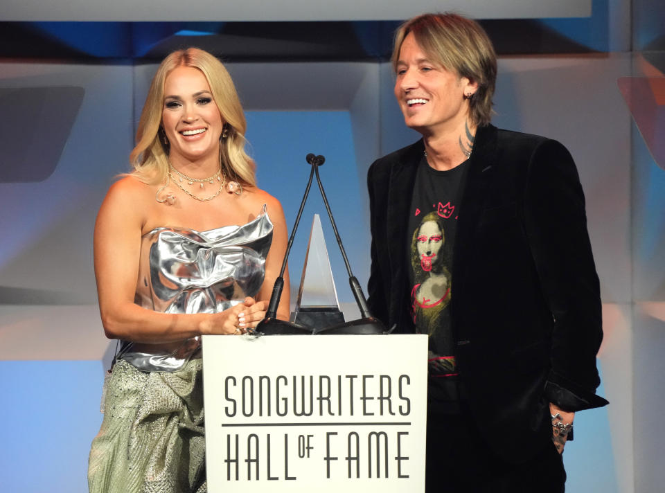 NEW YORK, NEW YORK - JUNE 13: Carrie Underwood and Keith Urban speak onstage during the 2024 Songwriters Hall of Fame Induction and Awards Gala at New York Marriott Marquis Hotel on June 13, 2024 in New York City. (Photo by Bennett Raglin/Getty Images  for Songwriters Hall Of Fame)