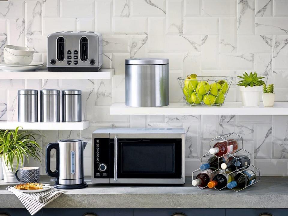 A kitchen with appliances on the counter