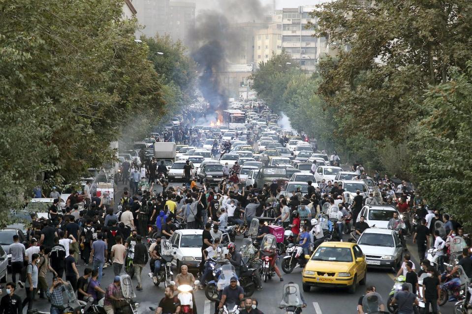 Protesters chant slogans during a protest over the death of Mahsa Amini on Sept. 21, 2022. (AP Photo)