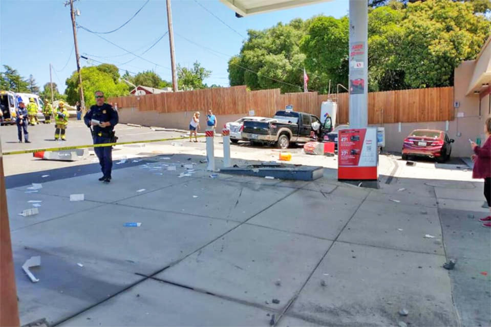 Emergency personnel respond to the site of a crash at a Texaco gas station near Auburn, Calif., on May 11, 2021. (California Highway Patrol via Facebook)