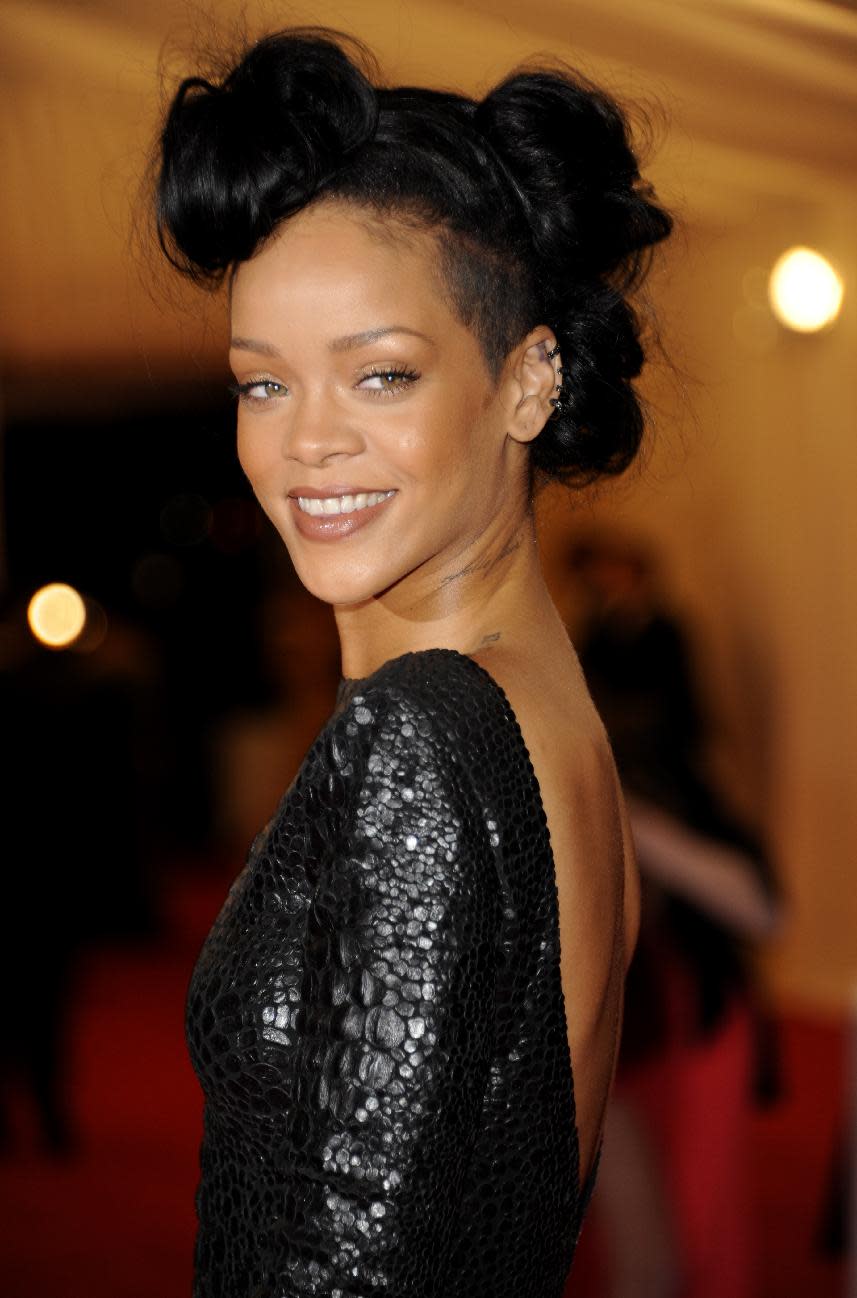 Rihanna arrives at the Metropolitan Museum of Art Costume Institute gala benefit, celebrating Elsa Schiaparelli and Miuccia Prada, Monday, May 7, 2012 in New York. (AP Photo/Evan Agostini)