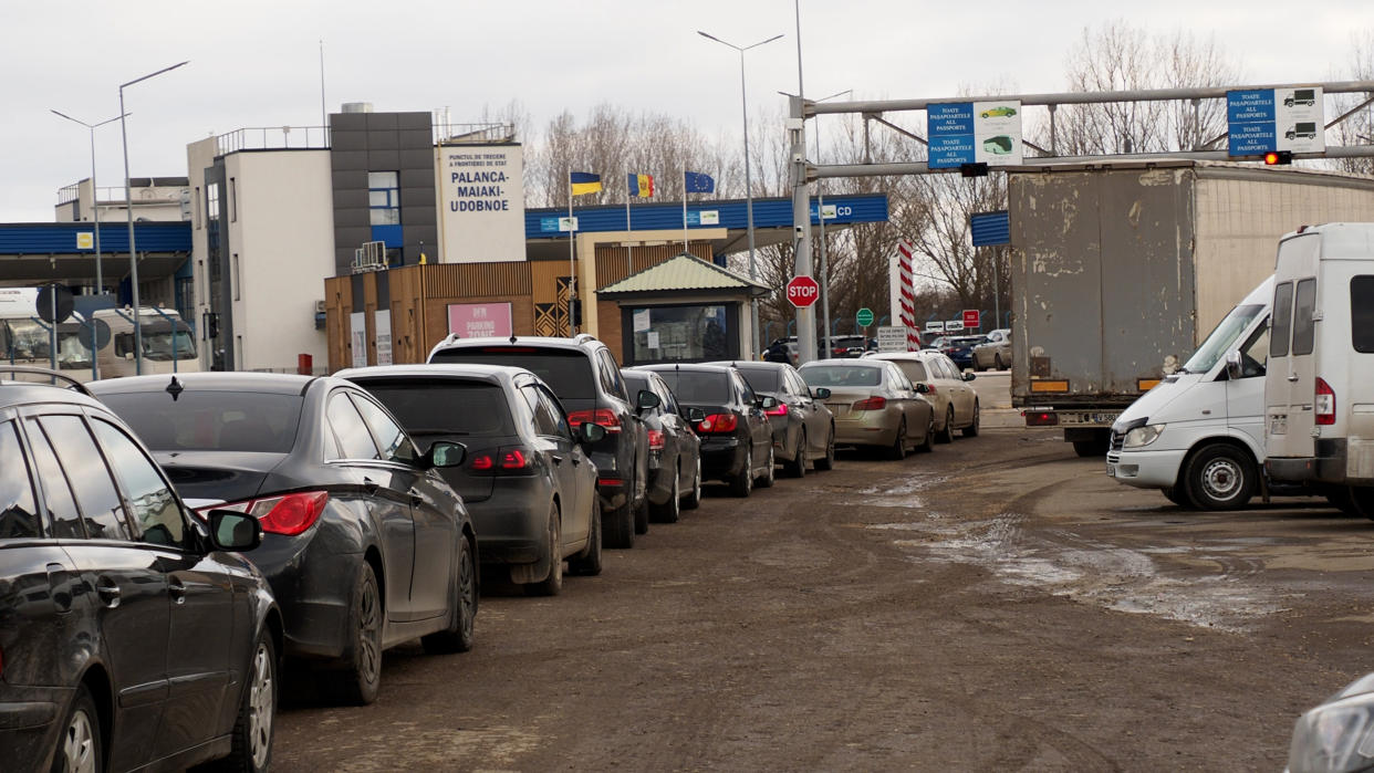 Drivers wait to enter Ukraine at the Moldovan border