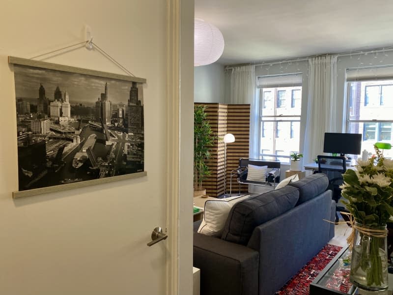 A black-and-white photo hangs on a door overlooking the living room.