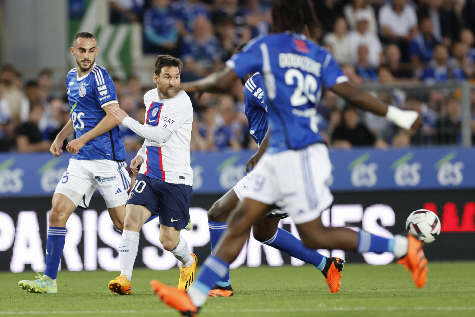 PSG's Lionel Messi, second left, in action during the French League One soccer match between Strasbourg and Paris Saint Germain at Stade de la Meinau stadium in Strasbourg, eastern France, Saturday, May 27, 2023. (AP Photo/Jean-Francois Badias)