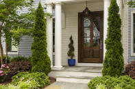 <p> Incorporating trees and shrubs into your front yard landscaping ideas will provide the backbone to your front garden planting scheme. However, this greenery should not just be reserved for your garden – incorporate it into your front porch ideas, too.  </p> <p> 'Unite your home with your front yard by bringing nature right to your doorstep! Weave your porch balcony in garlands, frame your door with flowers and turn your steps into podiums for your plants. This will create an effortless transition from lawn to lounge and add an inviting presence when guests visit your home,' recommends Volodymyr Barabakh, co-founder of Structural Beam. </p>