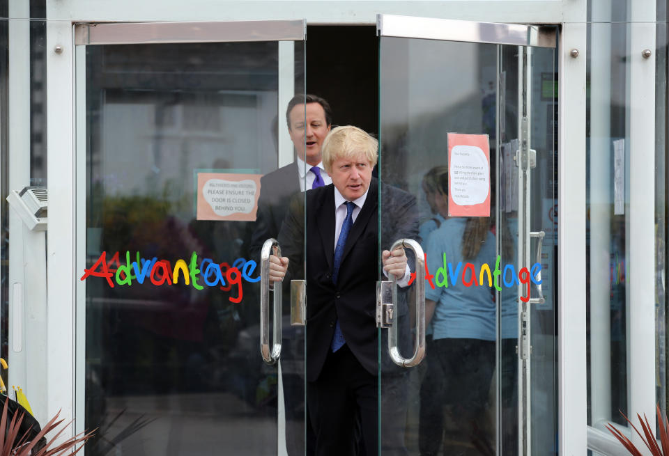 Prime Minister David Cameron (back) and Mayor of London Boris Johnson leave following a General Election campaign visit to Advantage Children's Day Nursery in Surbiton, Surrey.