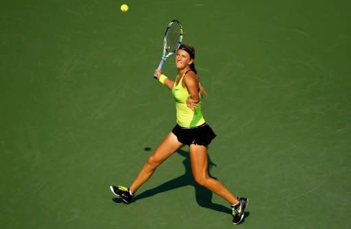 Victoria Azarenka of Belarus returns a shot during her women's singles semifinal match against Maria Sharapova of Russia at the 2012 US Open on September 7, 2012 in New York City. Azarenka defeated Sharapova 3-6, 6-2, 6-4 to reach her first New York final