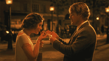 Owen Wilson lighting a cigarette in "Midnight in Paris"