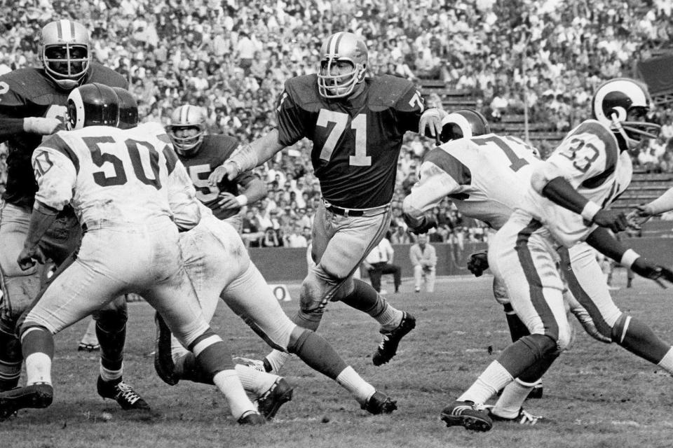 FILE- In this undated file photo, Detroit Lions defensive tackle Alex Karras (71) plays against the Los Angeles Rams. Karras' installment into the Pro Football Hall of Fame should put to rest years of speculation about why he wasn’t inducted sooner. (Detroit Lions via AP)