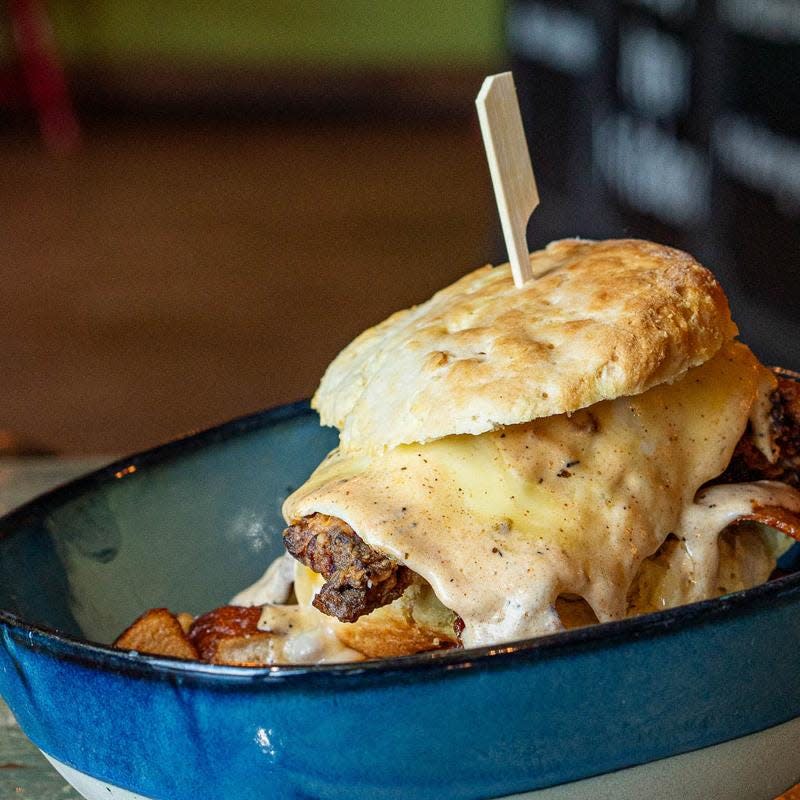 The Dirty South Biscuit from Cast Iron Kitchen in Wilmington was featured on Food Network’s "Diners, Drive-Ins and Dives" series. It has fried chicken, bacon, runny egg, muenster and pepper-jack cheese with sausage gravy and potatoes.