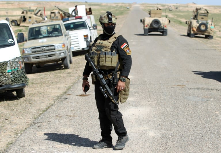 Iraqi soldiers gather at the frontline in the al-Anbar desert, 50 kilometres (30 miles) northeast of Haditha, on March 9, 2016